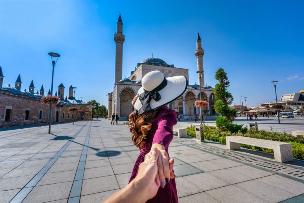 women-tourists-holding-man-s-hand-leading-him-mosque-konya-turkey-1-1536×1024